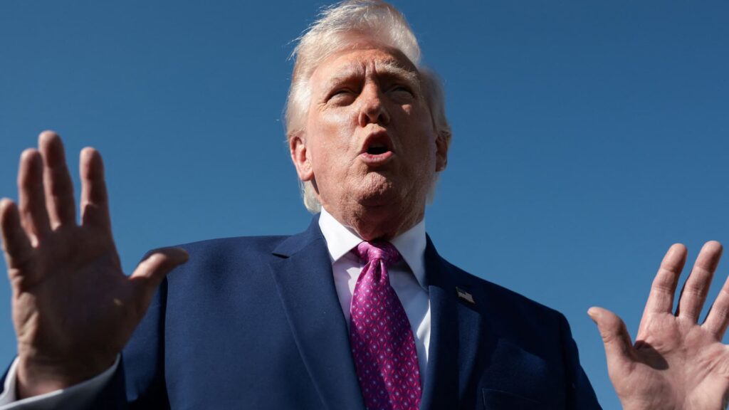 Trump Truth social post threatens Iran with its AI photo with a gun